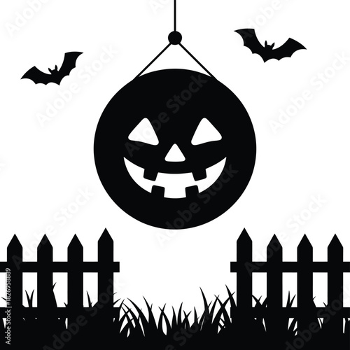 Silhouette of a spooky halloween pumpkin lantern with bats and fence
