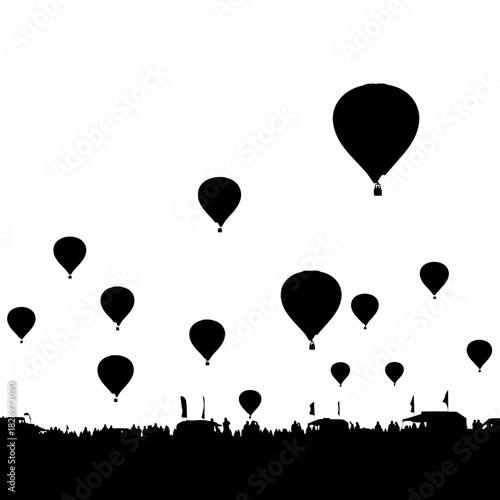 Silhouette of hot air balloons in flight during an outdoor festival event atmosphere