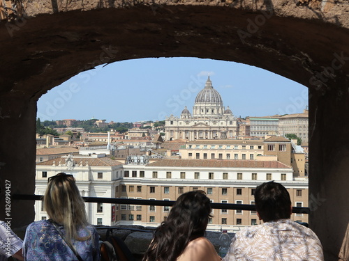 Tourist admiringthe Rome skyline from Castel Sant'Angelo