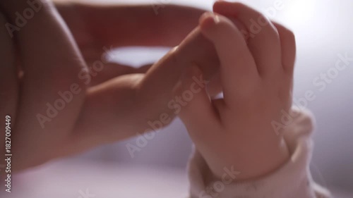 Wallpaper Mural Close-up view of unrecognizable parent gently touching tiny hand and fingers of newborn baby Torontodigital.ca