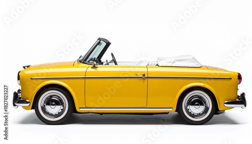 Classic yellow convertible with chrome accents and whitewall tires on plain white background, side view.