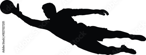 Silhouette of a goalkeeper diving to save a ball in mid air