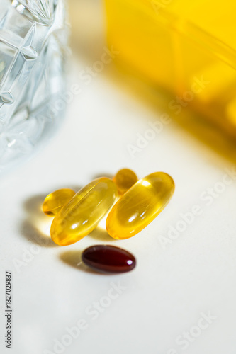 Pills, Vitamins near Container for Vitamins