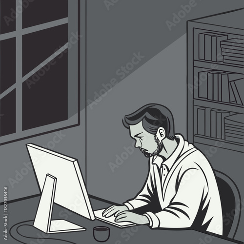 Man working on computer at night in dimly lit office