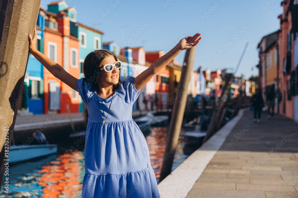 Obraz premium Young girl enjoying travel on Burano island in Venice
