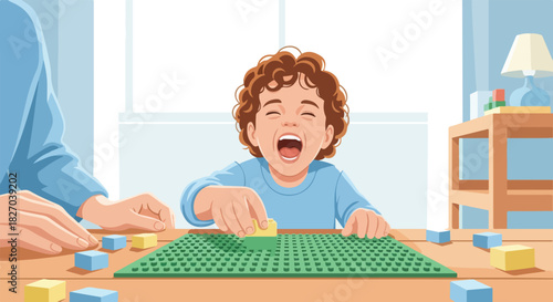 A young child with curly hair laughs while playing with building blocks on a green baseplate, assisted by an adult's hand.