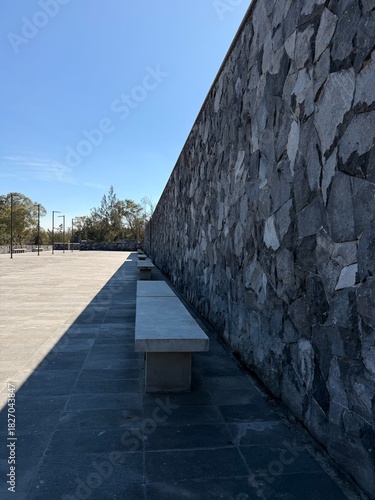 old stone wall with blue sky