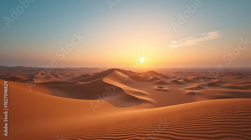 Fototapeta Naklejka Na Ścianę i Meble -  Golden sunset over desert landscape endless sand dunes nature scenery tranquil travel destination under warm sunlight for outdoor adventure and exploration