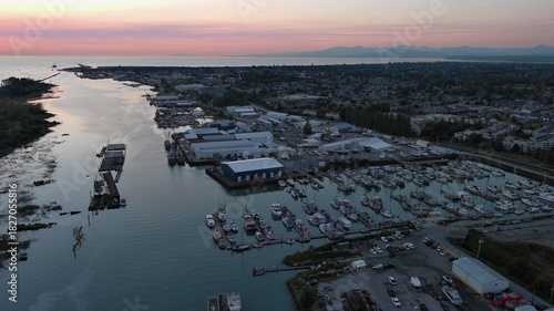 Aerial view of marina and buildings below