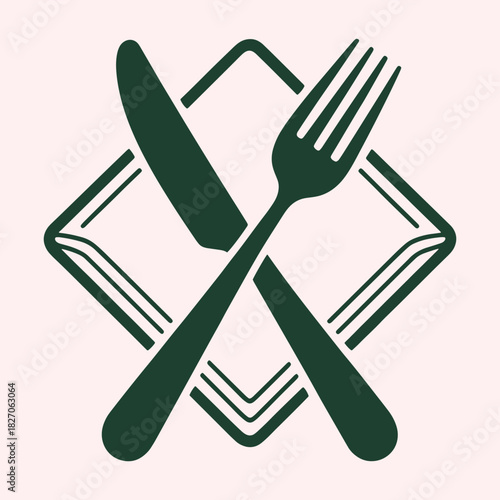 Dark green fork and knife crossed over a folded napkin on a pale pink background cutlery dining
