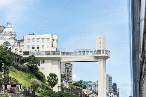 View of the iconic Lacerda Elevator in Salvador, Bahia, in focus, connecting the upper and lower parts of the city.