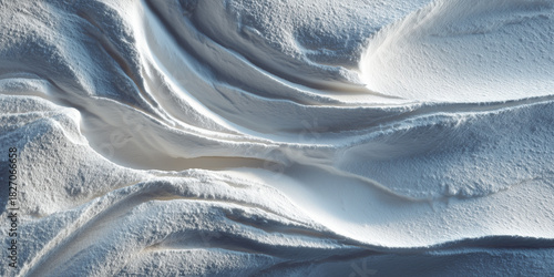 Abstract texture of white sand with flowing curves in daylight  