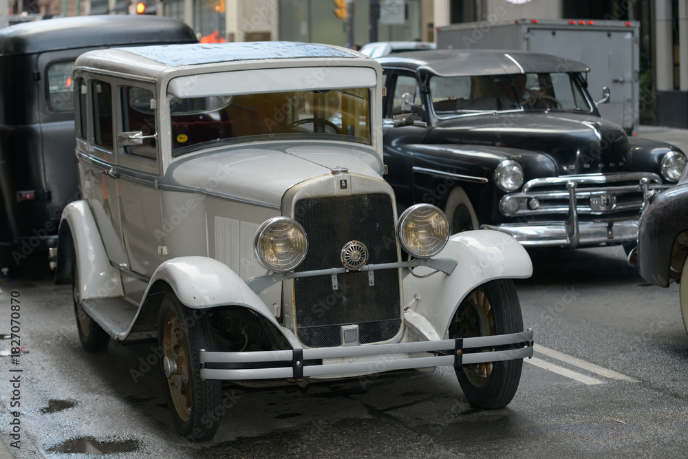 Fototapeta premium vintage automobiles on a film set along Bay St, Toronto