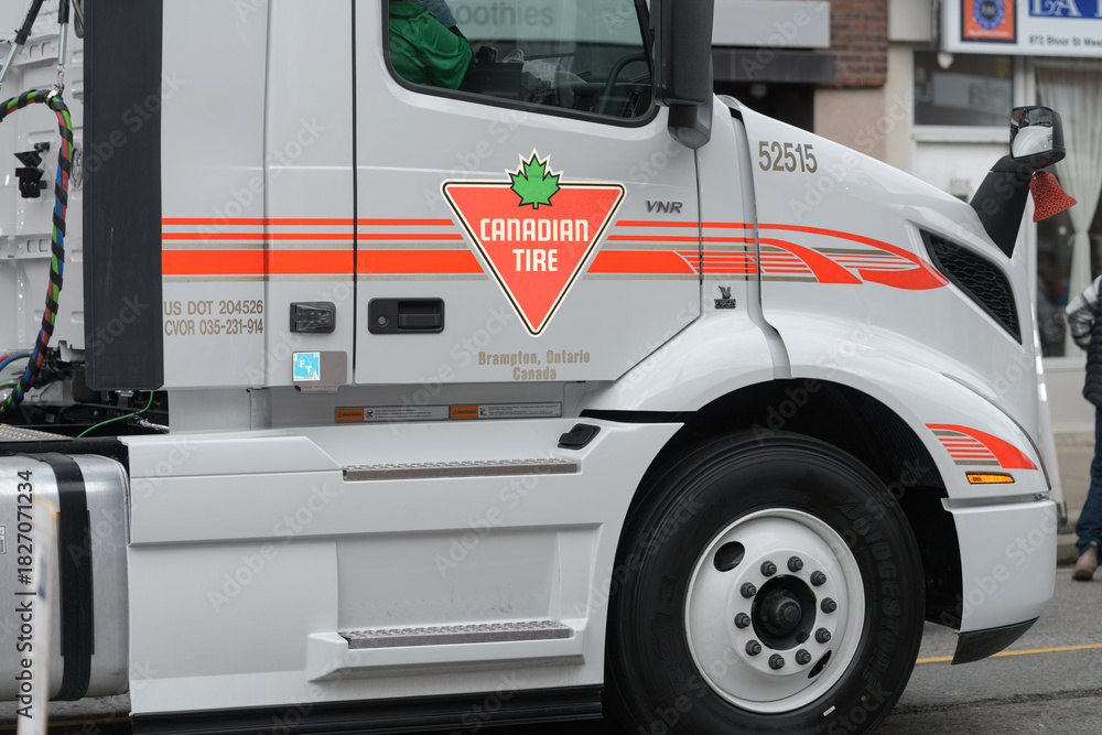 Fototapeta premium detail of a tractor unit featuring Canadian Tire logo at The Original Santa Claus Parade, Toronto