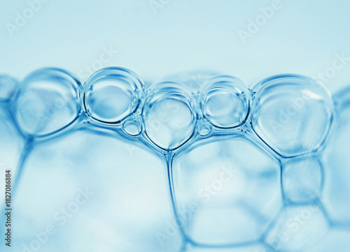 macrophotography of air bubbles on a light blue background, the details of the connection are visible