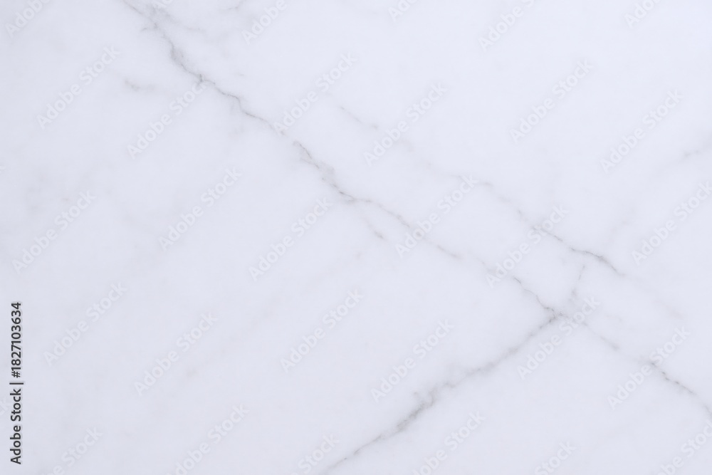 Obraz premium Elegant White Marble Texture Background with Subtle Veining, Perfect for Design Overlays and Mockups
