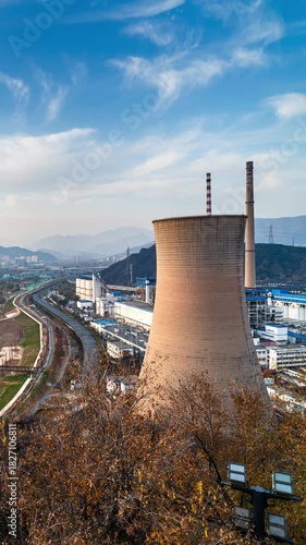 Beijing Shougang Park industrial landscape — power plant cooling towers and factory area under blue skies and white clouds