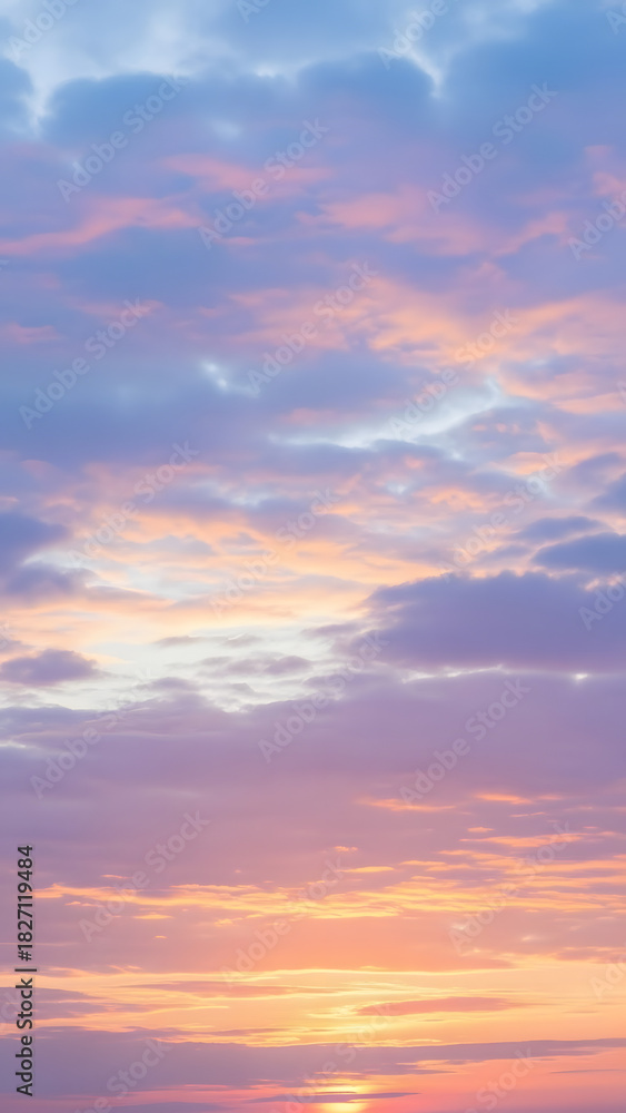 Obraz premium Soft Cloudy Sky with Pastel Sunset Colors - Vertical 4K Dreamy Nature Background