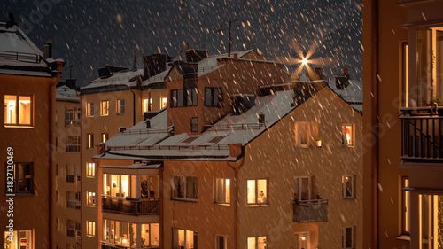 A row of apartment buildings with snow on the roofs