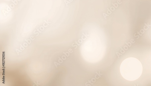 Soft beige background with blurred lights creating a dreamy and ethereal abstract visual texture effect