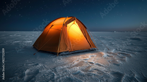 An orange expedition tent standing alone in the vast Arctic wilderness during a polar night