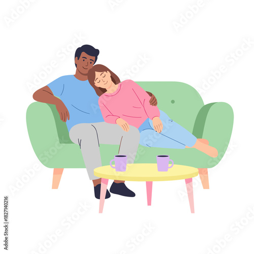 Interracial couple relaxing indoors on green sofa with coffee mugs  