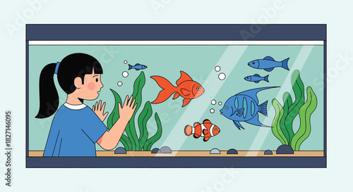 Young girl with a ponytail watching colorful fish in a home aquarium.