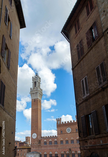 Medieval Tower Framed by Historic Buildings