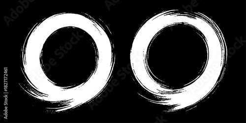 Two bold black ink circles painted with dynamic brush strokes, minimalist Japanese sumi-e style, clean background.