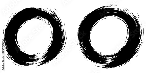 Two bold black ink circles painted with dynamic brush strokes, minimalist Japanese sumi-e style, clean background.