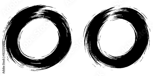 Two bold black ink circles painted with dynamic brush strokes, minimalist Japanese sumi-e style, clean background.