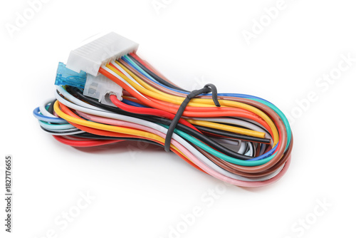 Multi-colored electrical wires with a fuse, intended for connecting a car radio, on a white background.
