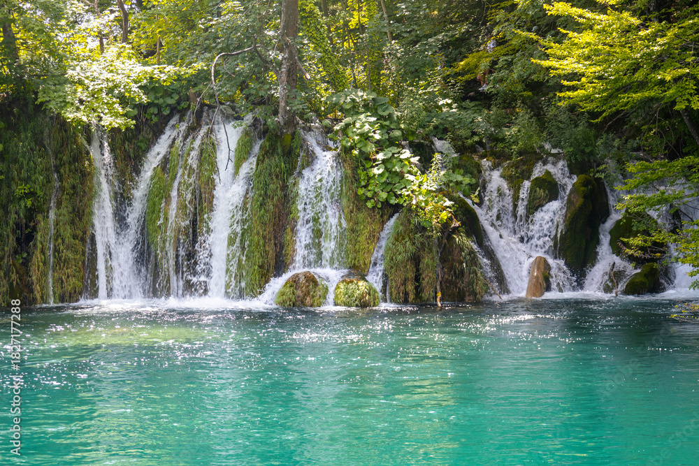 Naklejka premium Waterfalls in the park, Beautiful summer landscape near the lake and waterfalls, Plitvice Lakes, Croatia
