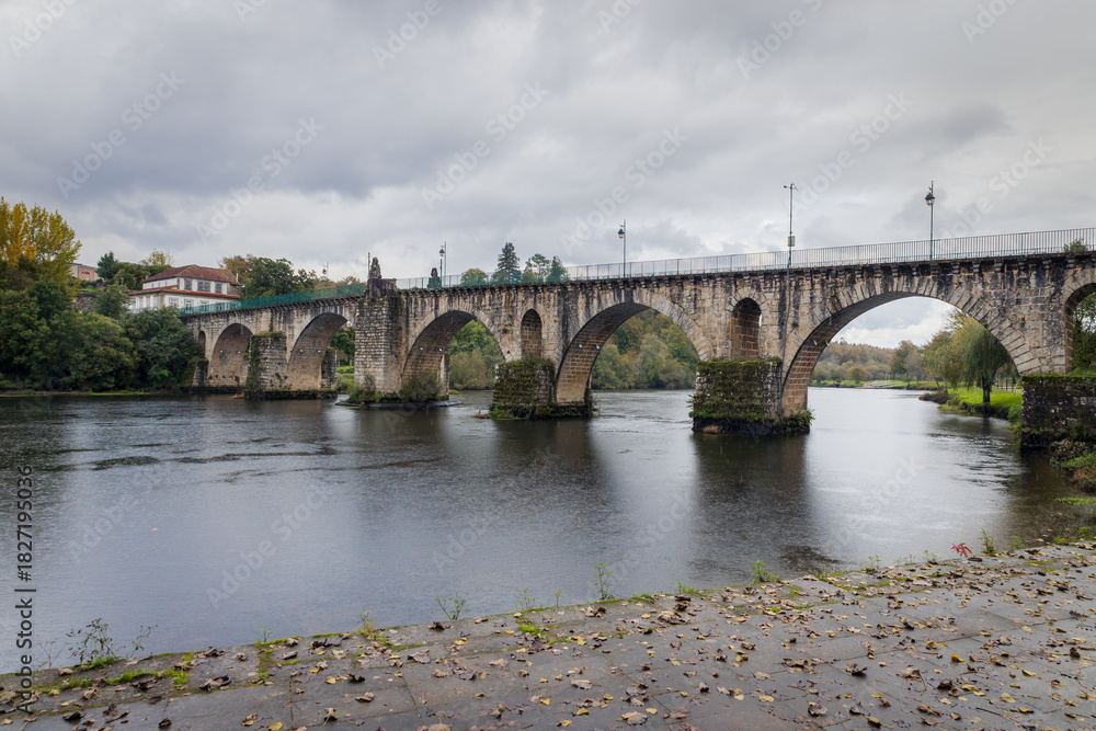 Fototapeta premium Ponte da Barca bridge over Lima river. Ancient portuguese village.