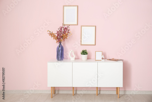 White sideboard with decor ...