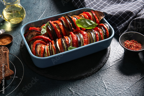 Fotografie Baking dish of tasty Ratatouille on black background