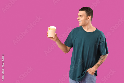 Young man with french fries...