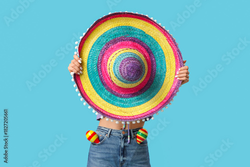 Young woman covering face w...
