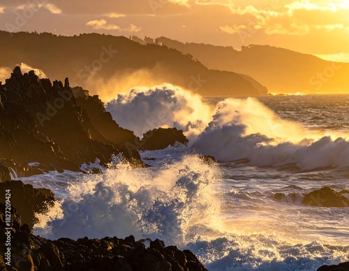 Golden light bathes ocean waves crashing against jagged coastal rocks