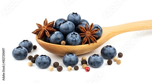 Blueberries and star anise in wooden spoon with peppercorns blueberry spice
