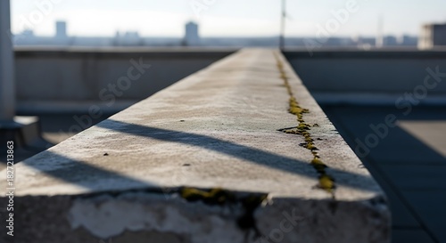 Urban concrete edge detail with cityscape view and structural shadow