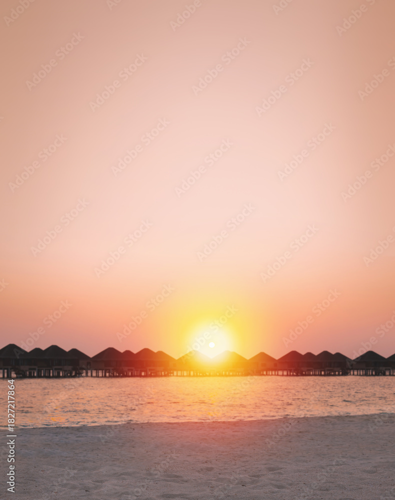 Fototapeta premium Sunset scene at Maldives beach, luxury water lodges. Travel destinations