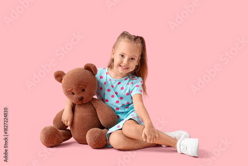 Cute little girl with teddy...