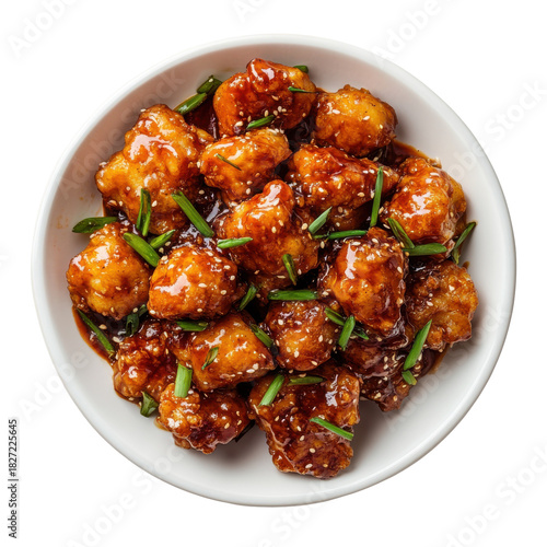 Delicious, crispy chicken bites in a sweet and savory glaze garnished with fresh chives, served in a white bowl. on transparent background