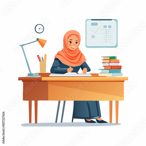 Female student with hijab sitting at desk studying.