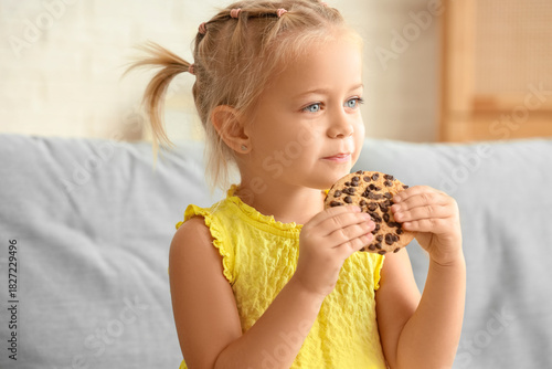 Cute little girl eating tas...
