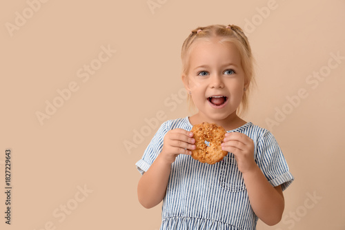 Cute little girl eating tas...