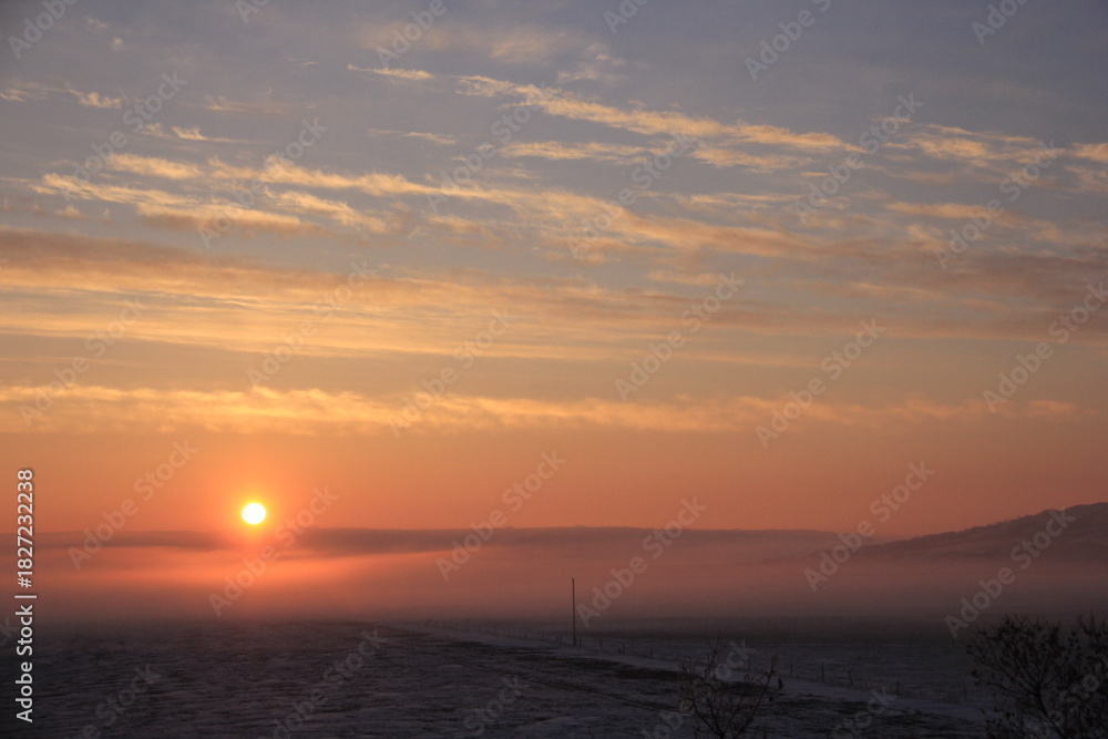Fototapeta premium Crisp and Cold Sunrise in the Fog Covered Valley.