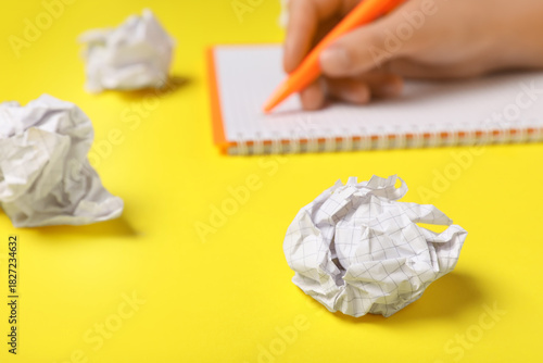 Female hand with notebook a...