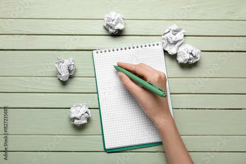 Notebook and crumpled piece...